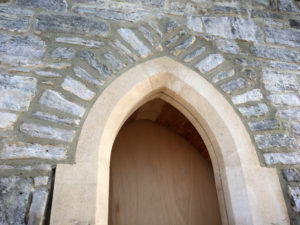 Recently rebuilt stone archway
